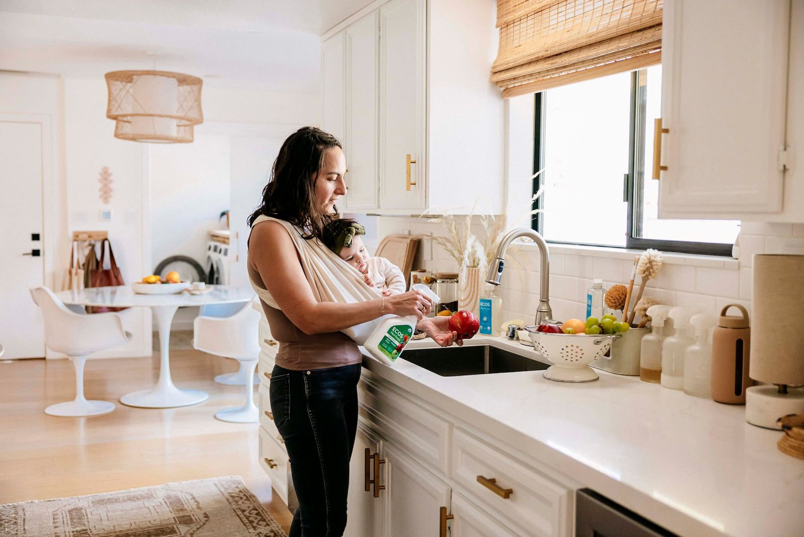 Woman With Baby Washing Produce